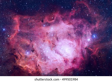 Lagoon Nebula. This giant cloud of gas and dust is creating intensely bright young stars, and is home to young stellar clusters. Retouched colored image. Elements of this image furnished by NASA. - Powered by Shutterstock