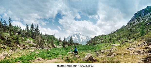 Lagorai, Italy: Mountaineer Sitting Admiring The Mountain Panorama.