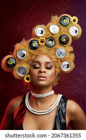 LAGOS, NIGERIA - Aug 09, 2021: A Portrait Of A Sexy Nigerian Woman With Blonde Afro Hair With Soda Can Caps On It