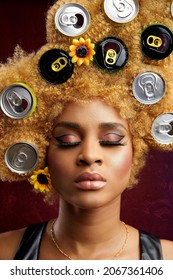 LAGOS, NIGERIA - Aug 09, 2021: A Portrait Of A Beautiful Nigerian Woman With Blonde Afro Hair With Soda Can Caps On It