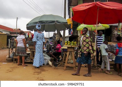 LAGOS, NIGERIA - AUGUST 10, 2012: People Selling Different Goods In The Street In The City Of Lagos, The Largest City In Nigeria And The African Continent