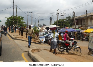 LAGOS, NIGERIA - MAY 11, 2012: People In The Street In The City View Of Lagos, The Largest City In Nigeria And The African Continent. Lagos Is One Of The Fastest Growing Cities In The World