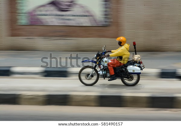 Lagos, Nigeria - September 13,\
2016: A law enforcer of the Lagos State Traffic Management (LASTMA)\
rides through independence tunnel in Maryland, Lagos\
Nigeria.