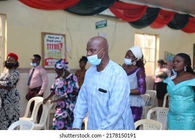 Lagos, Nigeria West Africa: April 20 2020:  An Old Man And Other People Worshiping In Pandemic Time In The Church 