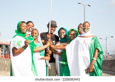 Lagos Nigeria West Africa- September 30 2022: Picture Of People Holding The Green And White Flag For Celebration