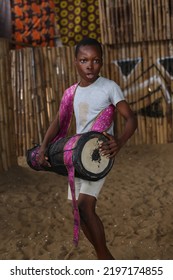 Lagos, Nigeria: A Young Nigerian Boy With Yoruba West African Drum In A Community Theatre For Dance And Drama