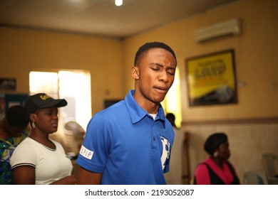 Lagos, Nigeria-August 21, 2022: A Teenage Boy Portrait In The Church Praying 