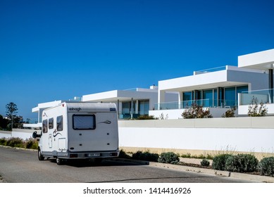 Lagos, Portugal -23 May,  2019: travel car on the road, beautiful white villas on the coast