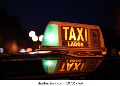 Lagos Taxi Sign Illuminated At Night, Algarve Portugal