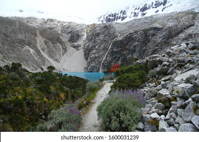 LAGUNA 69, HUASCARAN NATIONAL PARK. PERU - 17 April 2019. Laguna 69 Is One Of The Most Famous And Iconic Hikes In Peru And You Reach To Turquoise Waters At The End Of A Long And Beautiful Trail.