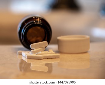 Laguna Hills, CA / USA - 07/07/2019: Spilled Bottle of Alprazolam tablets Better Known as Xanax; Used to Treat Panic and Anxiety Disorders.  This Prescription Was Filled in Mexico.