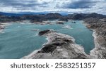 Laguna Verde is connected by a narrow strait to the neighboring lake Laguna Blanca (area 9.7 km2). During the last glaciation, the lakes were a single body of water, and the water level was about 45 m