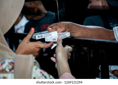 Lahat, Indonesia - 03rd July 2013: People Buying Cigarettes