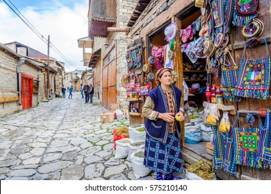 LAHICH, AZERBAIJAN - OCTOBER 1: View over local street in Lahich, people chatting and shop with bags, souvenirs and herbs. October 2016