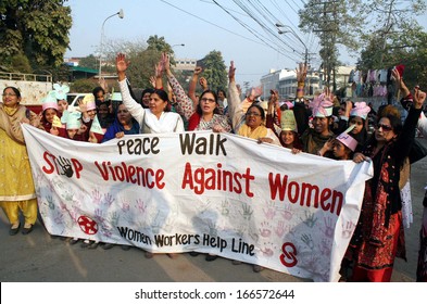 LAHORE, PAKISTAN - DEC 09: Women Workers Helpline Chant Slogans Against Torture On Women And Demanding Stop Violence Against Women During Protest Demonstration On December 09, 2013 In Lahore.