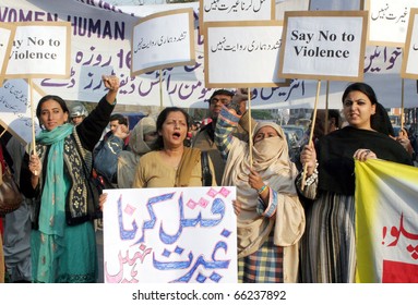 LAHORE, PAKISTAN - NOV 29: Supporters Of Women Workers Helpline Shout Slogans Against Torture On Women During A Protest Demonstration On November 29, 2010 In Lahore, Pakistan.