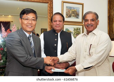 LAHORE, PAKISTAN, SEPT 23: Punjab Chief Minister, Shahbaz Sharif receives cheque of Rs. 3.7 million from China Ambassador, Liu Jian for CM Flood Relief and Tameer-e-Pakistan Fund  during meeting September 23, 2010 in Lahore, Pakistan