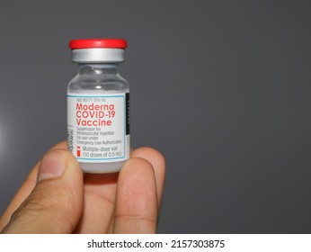 Lahore, Punjab  Pakistan - July 28 2021: Covid 19 Ten Doses Bottle Of Moderna Vaccine In Hand With Copyspace.