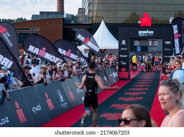 Lahti Finland - July 2, 2022. Semi-iron Triathlon IRONMAN 70.3 FINLAND 2022! The Athlete Is Approaching The Finish Line.