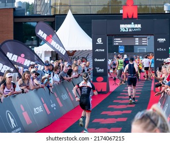 Lahti Finland - July 2, 2022. Semi-iron Triathlon IRONMAN 70.3 FINLAND 2022! The Athlete Is Approaching The Finish Line.