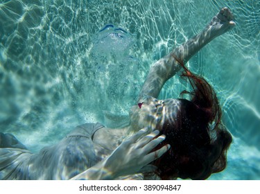 Laid back blowing bubble, ball gown underwater - Powered by Shutterstock