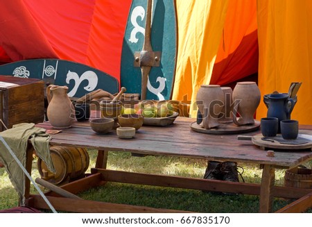 Laid table inside an ancient gallic tent in an encampment at a historical reenactment