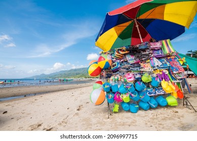 Laiya Beach, San Juan, Batangas, Philippines - Dec 2021: Beach balls, sand buckets, and other toys for sale at a beach stall.