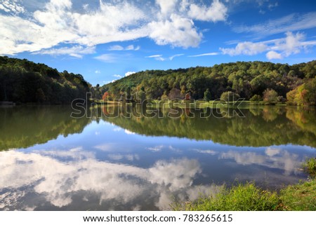 Lake Abbott under a cloud-filled sky in Autumn in Bedford, Virginia.