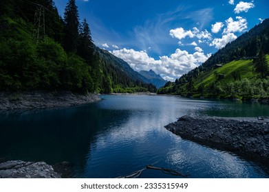 lake alps reflections, trees clouds - Shutterstock ID 2335315949