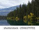 Lake Annette with trees and reflection. Jasper National Park, Alberta, Canada. Banff National Park.