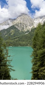 Lake Anterselva, Italy. Amazing view of the famous lake Anterselva. Alpine lake. Picturesque mountain lake at Dolomites. Wonderful nature contest. Iconic location for photographers