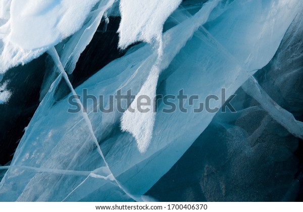 Lake Baikal ice\
under snow, Listvyanka\
village