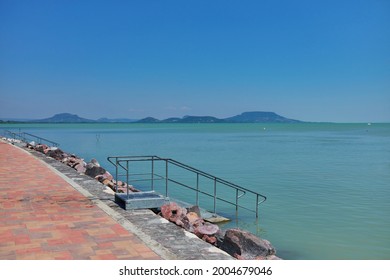 Lake Balaton Beach With Badacsony Mountain In The Background 