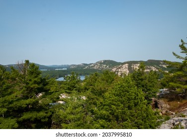 A Lake Bay Of Conifers In Sudbury, Ontario, Canada