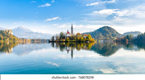 Lake Bled Slovenia. Beautiful mountain lake with small Pilgrimage Church. Most famous Slovenian lake and island Bled with Pilgrimage Church of the Assumption of Maria and reflection in calm water.