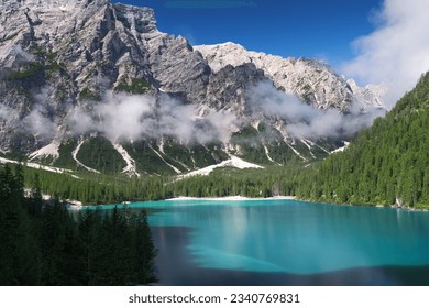 Lake Braies (also known as Pragser Wildsee or Lago di Braies) in Dolomites Mountains, Sudtirol, Italy. Romantic place with typical wooden boats on the alpine lake. Hiking travel and adventure. - Powered by Shutterstock
