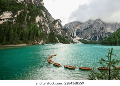 Lake Braies (Lago di Braies, Pragser Wildsee) in Dolomites Alps, South Tyrol. Best touristic place in Dolomites. Lake with typical rowing wooden boats.