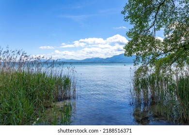 The lake called Chiemsee in Bavaria, Germany at a cloudy but bright day in summer.