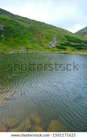 Similar – Stone jetty by the lake