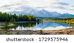 Lake Cicely Altai, Siberia, cloudy autumn day. Taiga, beautiful sky, haze, mountains with snow peaks, panorama.