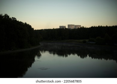 Lake in city. Pond in evening. Natural object in park. Forest reflection in water. City park. - Shutterstock ID 2205687805