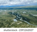 Lake Clark National Park in Alaska. Emerson Creek and Falls. Aerial view of spruce trees, rugged mountains near Twin Lakes.