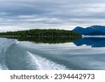 Lake Clark National Park, Alaska. Lake Clark in Lake Clark National Park and Preserve in Alaska. Turquoise lake with rugged mountains, islands and shore. Denaʼina: Qizhjeh Vena. Tommy Island, wake. 