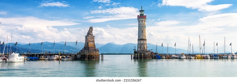 Lake Constance, panoramic view of harbor entrance in Lindau island, Germany, Europe. Landscape with old lighthouse in marina, scenic panorama of Bodensee in summer. Lindau is attraction of Bavaria. - Shutterstock ID 2151336267