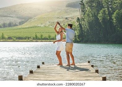 Lake, dancing and happy nature couple on outdoor quality time together, fun countryside adventure or bonding getaway. Freedom peace, water and playful woman, man or romantic people dance on love date - Powered by Shutterstock