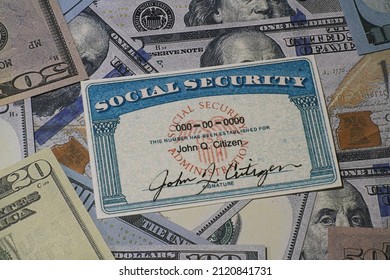 Lake Elsinore, CA, USA - January 30, 2022: Fake Social Security Card On Prop US Currency - Concept Of Social Security Benefits