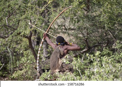 LAKE EYASI, ARUSHA/TANZANIA-CIRCA FEBRUARY 2013: an unidentified member of the Hadza tribe hunts circa Feb 2013 in Lake Eyasi. Hadza is the last tribe of hunter-gatherer, clic-speakers of Tanzania.