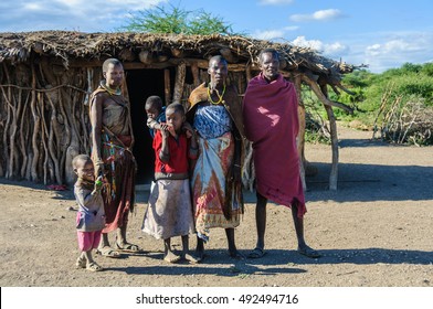 LAKE EYASI, TANZANIA - MAY 29, 2015: A Datoga family in front of their home at Lake Eyasi, Tanzania