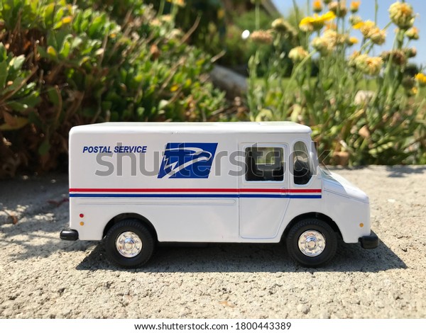 LAKE FOREST, CALIFORNIA / USA. - August 17: A toy\
postal truck on a street on August 17, 2020 in Lake Forest,\
California, USA.