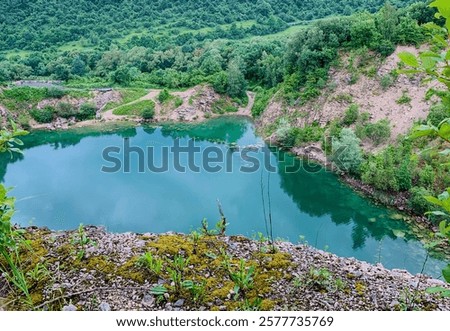Lake Beňatina is a former flooded quarry located in Slovakia in the cadastre of the village of Beňatina, district of Sobrance.